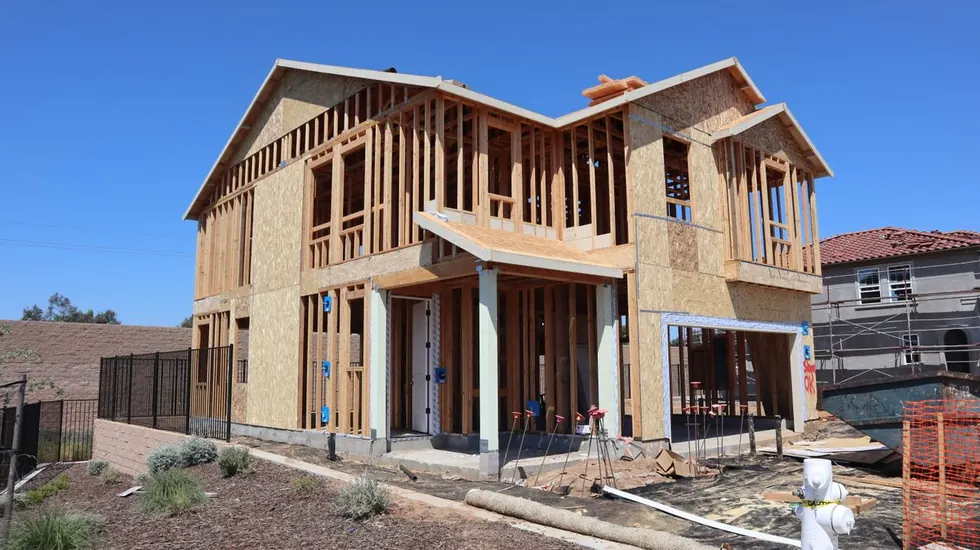 Production home framed and sheathed in a new community